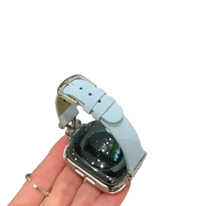 Replacement leather strap and case compatible with Apple Watch, light blue color design.