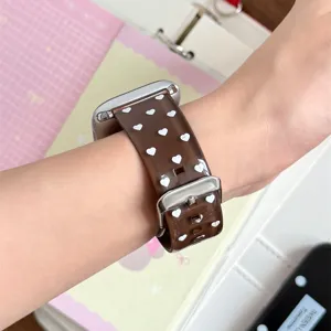 Brown translucent TPU silicone watch band with white hearts compatible with Apple Watch.