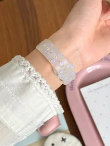 Close-up detail of purple heart frosted TPU smartwatch strap worn on wrist, soft aesthetic.