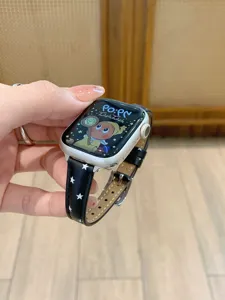 Star pattern leather watch band compatible with Apple Watch, stylish accessory strap.