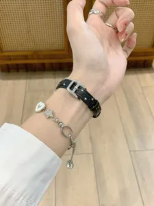 Chic star print leather apple watch band detail view, stylish wrist accessory for daily wear.