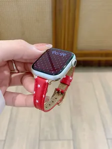 Red leather watch band compatible with apple watch featuring cute white star pattern.
