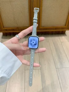 Close-up detail of grey leather watch strap featuring cute white star patterns for smartwatches.