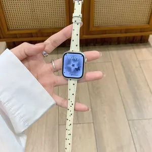 Star pattern leather watch band compatible with Apple Watch, stylish accessory for use.