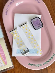 Detailed view of frosted TPU watch strap with cute yellow hearts and metal hardware details.
