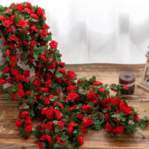 Close-up detail of artificial red rose vine garland, perfect for romantic home and wedding decor.