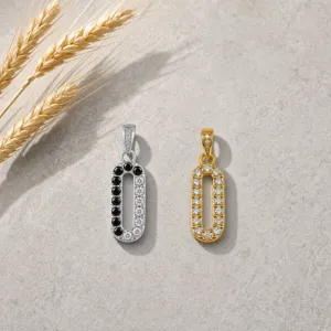 Elegant double tone oval pendant necklace charm with sparkling cubic zirconia stones.