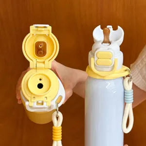 Detailed view of portable kids thermos water bottle with straw and cute double drinking design.