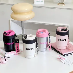 Portable insulated coffee cups with double-drink lids, detailed view in assorted pastel colors.