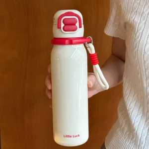 Portable white insulated thermos water bottle with red lid and strap for daily travel use.