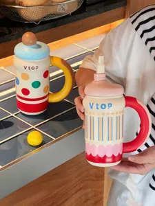 Detailed close-up view of creative insulated straw water cup with colorful polka dot design.