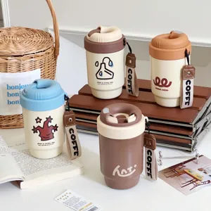 Detailed shot of portable mini insulated coffee cups featuring dual-drink lids and cute designs.