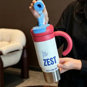 Stainless steel insulated tumbler with handle and straw lid, large capacity daily water cup detail.