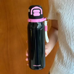 Kids insulated water bottle detail view, black pink design with strap, dual-drink lid.
