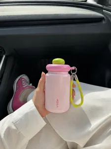 Portable mini stainless steel insulated water bottle with cute pink cap and handy lanyard strap.