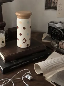 Mini cute thermos cup for women, portable small capacity water bottle with polka dots.