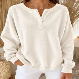 Detailed view of women's cozy Henley neck long sleeve fleece pullover sweatshirt.