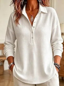 Detailed shot of women's waffle knit long sleeve lapel top, casual loose pullover shirt.
