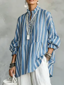 Close up detail view of casual striped long sleeve shirt with layered necklaces and bracelets.