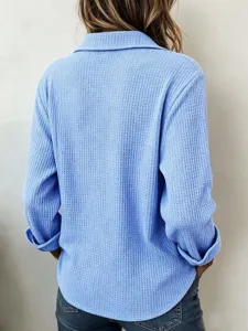 Back detail view of casual light blue waffle knit long sleeve top featuring lapel collar.
