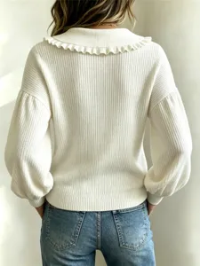Detailed back view of women's white ribbed knit sweater featuring a chic ruffled collar.