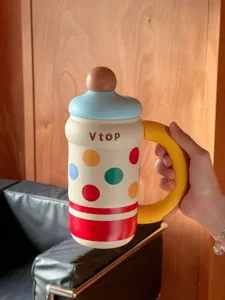 Large capacity thermal water bottle with colorful polka dot design and cute baby bottle shape handle.