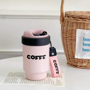 Mini insulated coffee cup with ceramic lining, portable strap design for daily use and gifts.