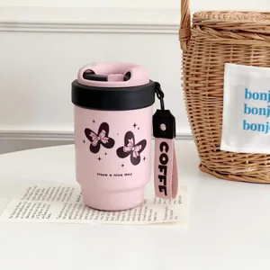 Portable insulated coffee cup with cute bow design, stainless steel travel mug for daily use.