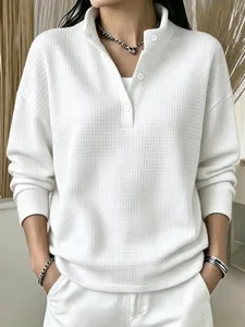 White waffle knit henley shirt for women, casual long sleeve button up pullover top.