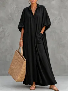 Black long sleeve maxi shirt dress with large pockets and button down design for casual chic daily wear.