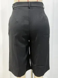 Detail view of black tailored shorts back showing high waist and clean fit design