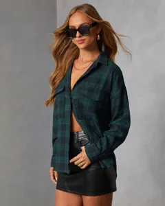 Green plaid long sleeve button up shirt detail featuring lapel collar and dual chest pockets.