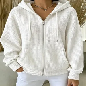 Comfortable white waffle knit zip up hoodie with drawstring and drop shoulder design.