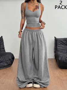 Casual grey two-piece set featuring a slim fit cropped tank top and wide leg sweatpants.