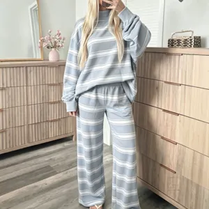 Detailed view of women casual striped lounge set, light blue long sleeve top and wide pants.