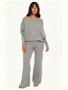 Grey knit two-piece set featuring an off-shoulder sweater and flare pants for women.