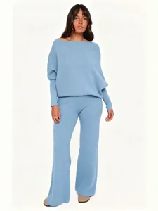 Chic light blue off-the-shoulder knit sweater and flared pants two-piece set for women.