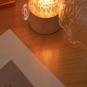 Crystal ambient lamp close up detail, wooden base warm light decoration for bedroom desktop.