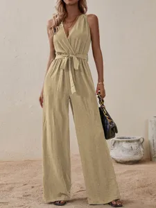 Close up of the sleeveless V-neck belted wide leg jumpsuit detail, elegant khaki fabric.