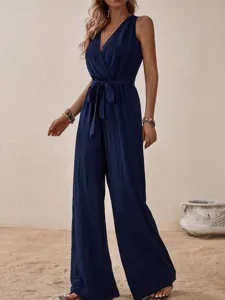 Navy blue sleeveless V-neck jumpsuit detail showing the waist tie and wide leg cut.