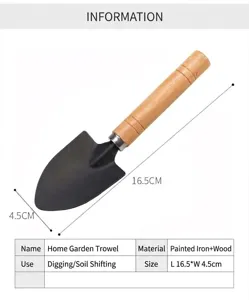 Close-up detail of the mini gardening shovel head and wooden handle, showing compact size.