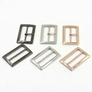 Metal buckles and rings details showing various finishes like gunmetal, silver and gold.