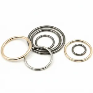Close-up detail shot of assorted metal rings and hardware loops in multiple sizes and finishes.