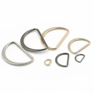 Detailed shot of assorted metal D-rings in various sizes and colors, ideal for bag and garment.