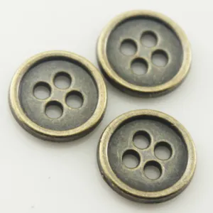 Vintage antique bronze metal four-hole sewing buttons for DIY crafts and clothing garments.
