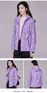 Purple camo windbreaker jacket details showing hood, front zipper, and adjustable cuffs.
