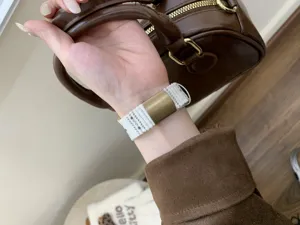 Corduroy watch strap detail, soft texture and metal buckle for smart watch replacement style.