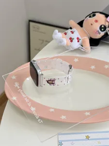 Detailed view of clear silicone watch strap featuring cute cartoon graphics for smartwatch.