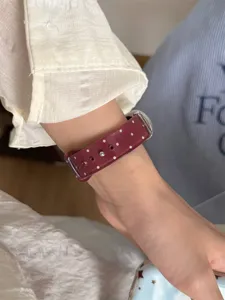 Maroon polka dot TPU sports watch band, flexible silicone strap compatible with smartwatches.