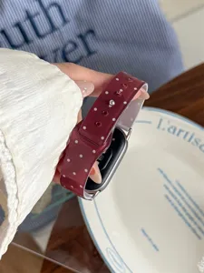 Wine red polka dot TPU sports watch strap compatible with Apple Watch, detailed view.